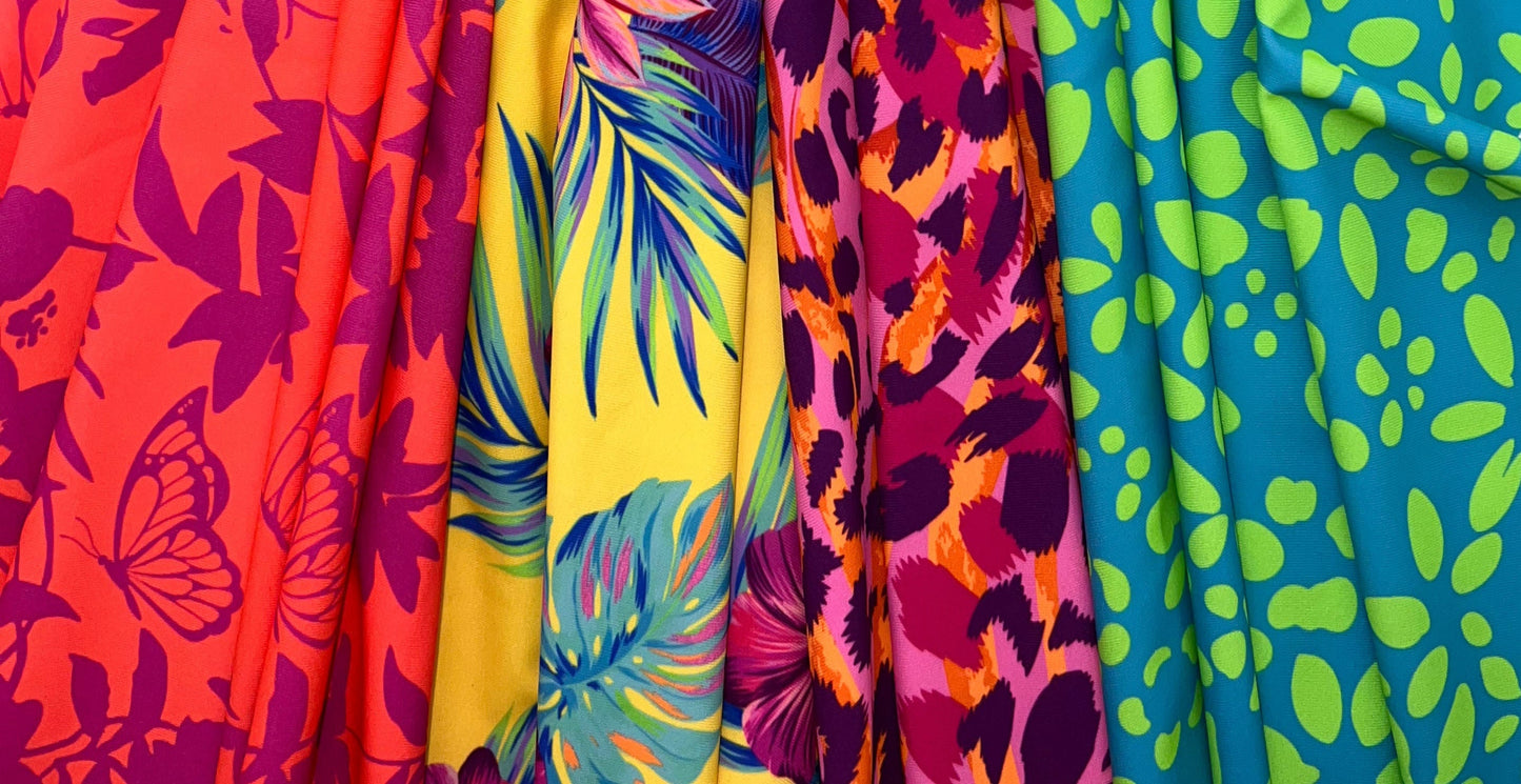 Four colorful fabric swatches with floral patterns on a white background. left to right: Mariposas, Kalani Floral, Safari Sorbet, Electric Florla.